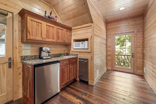 kitchen with dark stone counters, wood walls, dishwasher, and wood ceiling