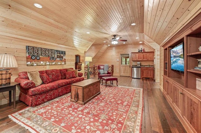 living room with ceiling fan, wood ceiling, wood walls, and dark hardwood / wood-style floors