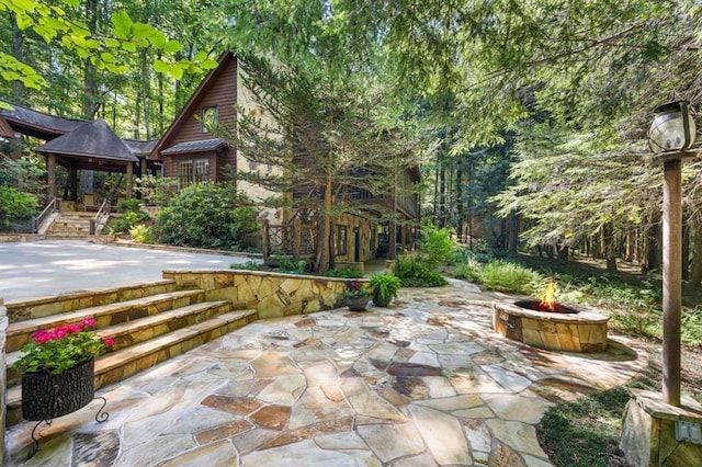 view of patio / terrace featuring a fire pit