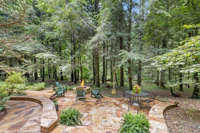 view of patio with an outdoor fire pit