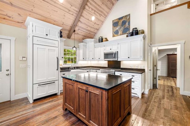 kitchen featuring white cabinets and appliances with stainless steel finishes