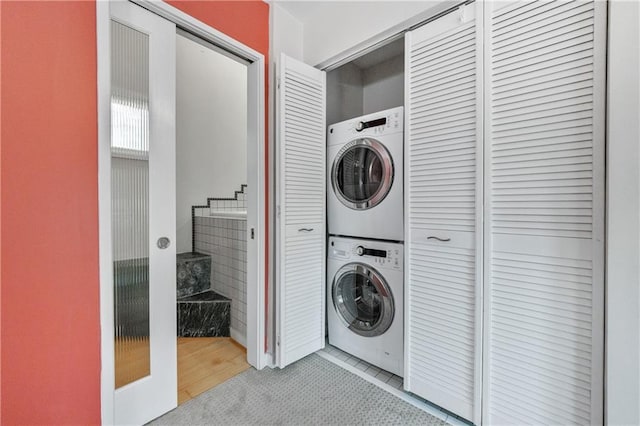 washroom with stacked washer and clothes dryer