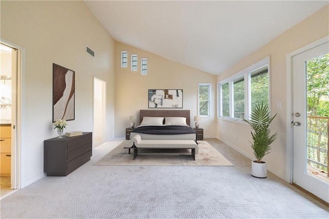 bedroom with light colored carpet, access to outside, and vaulted ceiling