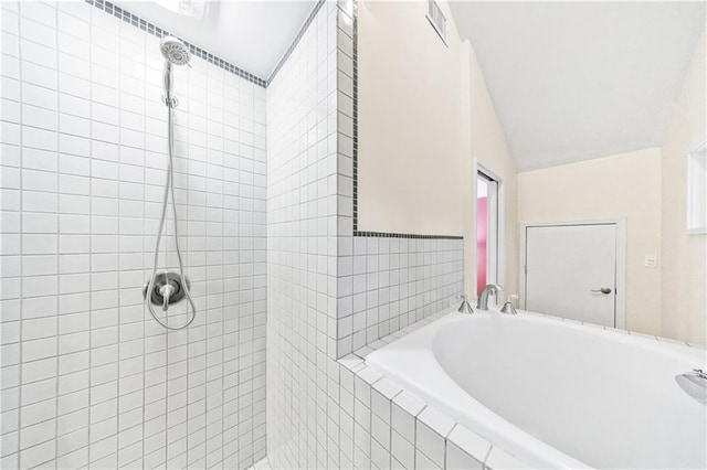 bathroom with independent shower and bath and tile walls