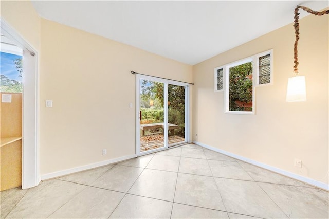 unfurnished room featuring light tile patterned floors