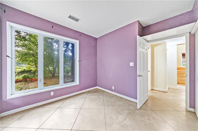 spare room with light tile patterned floors