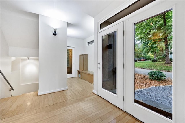 interior space featuring french doors and light hardwood / wood-style floors