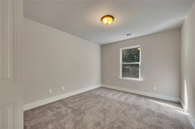 506 Tallapoosa Trl, Woodstock, GA 30188 - carpeted empty room with baseboards and visible vents