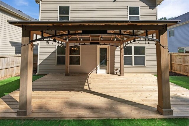 506 Tallapoosa Trl, Woodstock, GA 30188 - back of house featuring fence, a wooden deck, and a gazebo