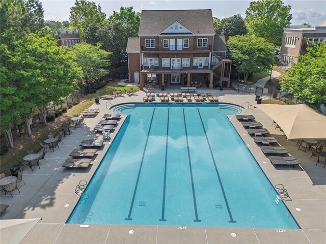 506 Tallapoosa Trl, Woodstock, GA 30188 - community pool with fence, stairs, a patio area, and a deck