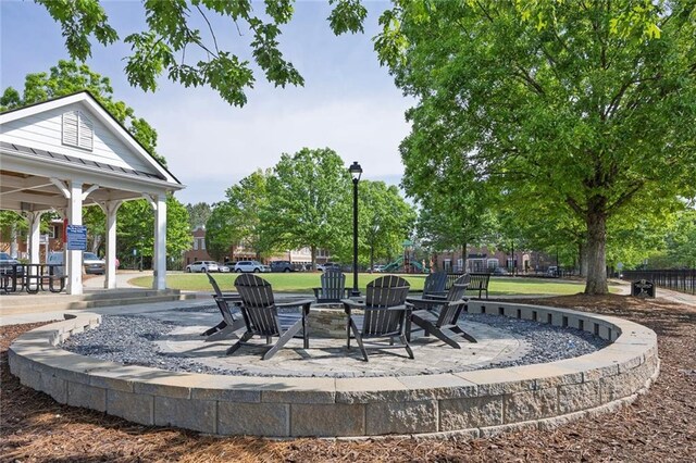506 Tallapoosa Trl, Woodstock, GA 30188 - view of patio / terrace with a gazebo, a fire pit, and playground community