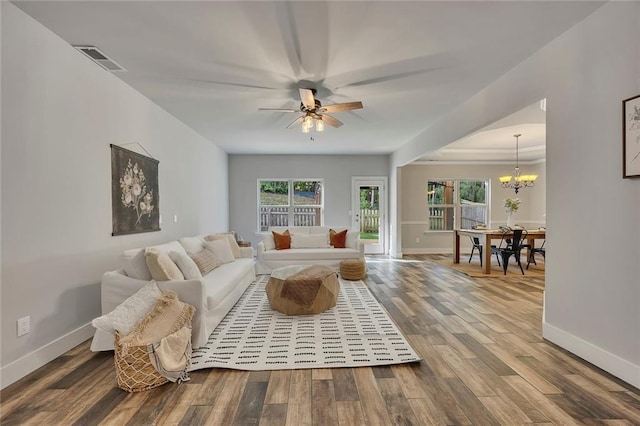 506 Tallapoosa Trl, Woodstock, GA 30188 - living area with baseboards, ceiling fan with notable chandelier, plenty of natural light, and wood finished floors