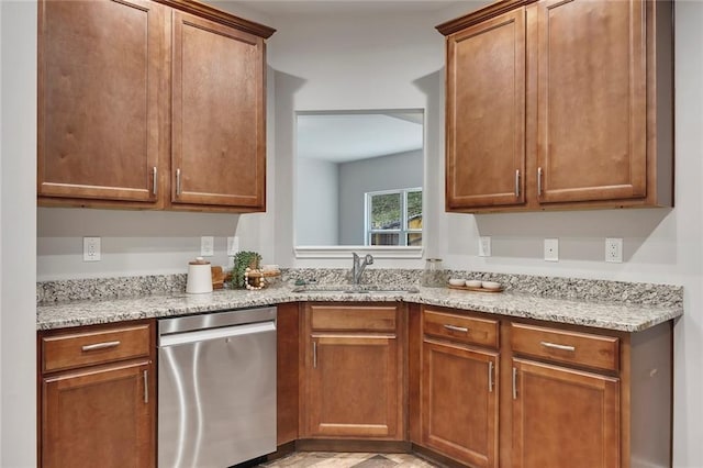 506 Tallapoosa Trl, Woodstock, GA 30188 - kitchen with brown cabinetry, stainless steel dishwasher, light stone counters, and a sink