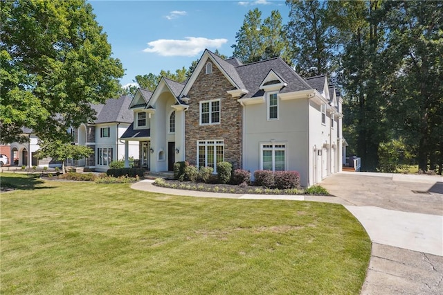 view of front of home featuring a front yard and a garage