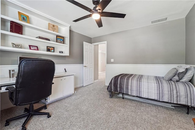 bedroom with ceiling fan and light colored carpet