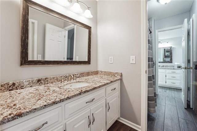 bathroom featuring vanity and hardwood / wood-style floors