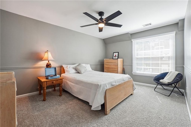 bedroom featuring ceiling fan, carpet floors, and vaulted ceiling