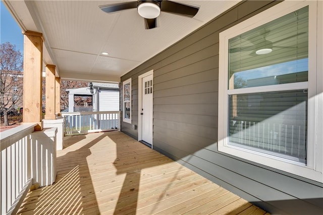 deck featuring ceiling fan and a porch