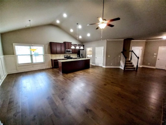 kitchen featuring a center island with sink, light countertops, dark wood-type flooring, dark brown cabinets, and appliances with stainless steel finishes