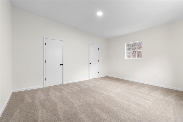 spare room featuring carpet