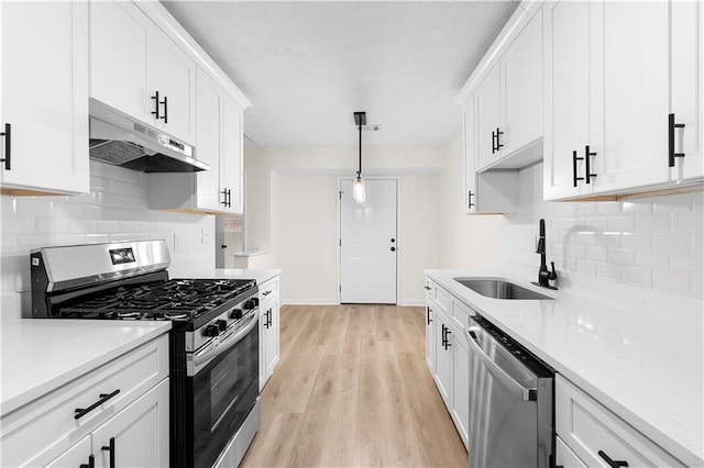 kitchen featuring white cabinetry, appliances with stainless steel finishes, and sink