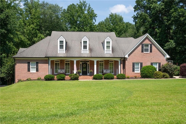 1642 Reflections Trl, Powder Springs, GA 30127 - cape cod home featuring brick siding, covered porch, and a front yard