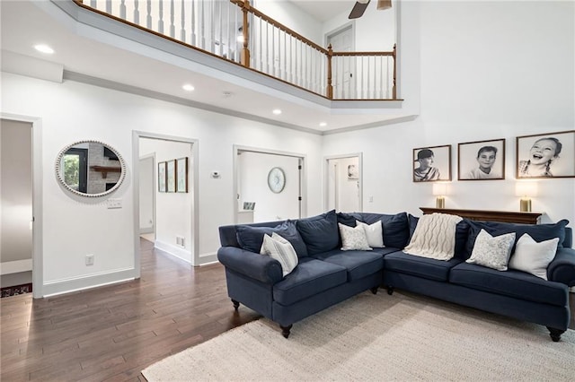 1642 Reflections Trl, Powder Springs, GA 30127 - living area featuring a towering ceiling, hardwood / wood-style floors, a ceiling fan, and recessed lighting