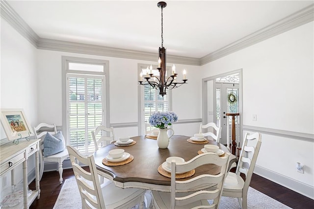 1642 Reflections Trl, Powder Springs, GA 30127 - dining room with a chandelier, ornamental molding, and dark wood-style flooring