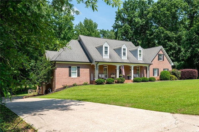 1642 Reflections Trl, Powder Springs, GA 30127 - cape cod-style house with a porch, brick siding, and a front yard