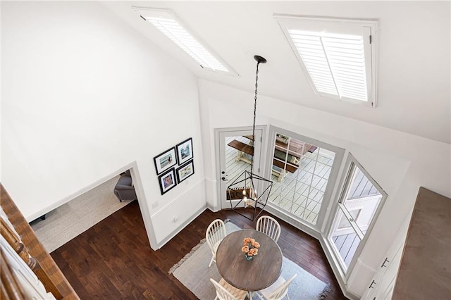 1642 Reflections Trl, Powder Springs, GA 30127 - living area featuring a chandelier, high vaulted ceiling, and dark wood-style floors