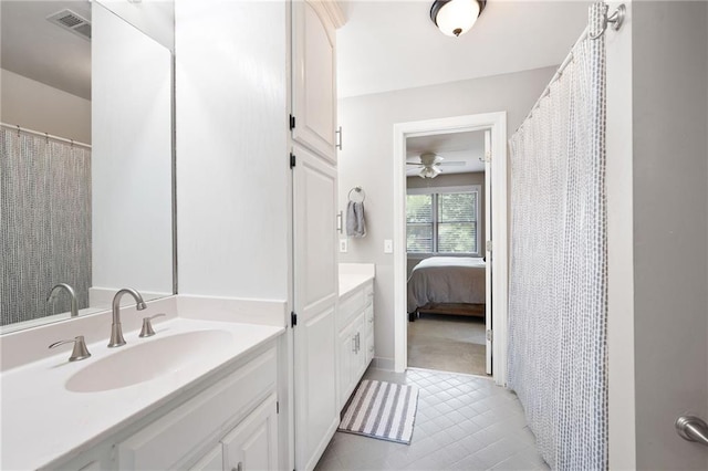 1642 Reflections Trl, Powder Springs, GA 30127 - full bathroom featuring vanity, a ceiling fan, ensuite bath, tile patterned flooring, and a shower with curtain