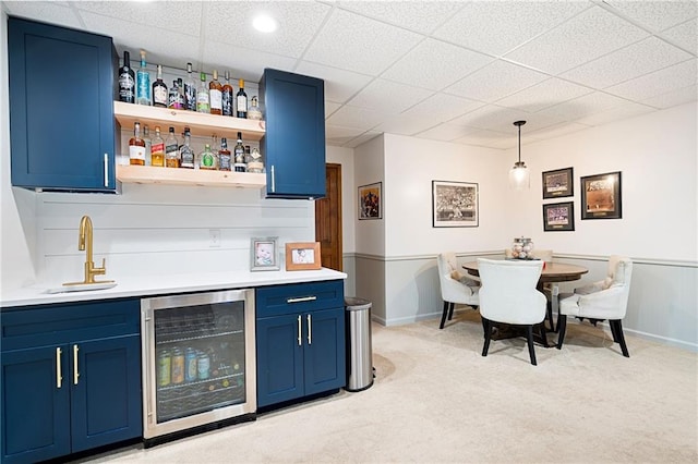 1642 Reflections Trl, Powder Springs, GA 30127 - indoor wet bar featuring wine cooler, light carpet, hanging light fixtures, and a drop ceiling