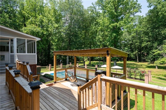 1642 Reflections Trl, Powder Springs, GA 30127 - wooden deck with a sunroom, a lawn, and view of wooded area