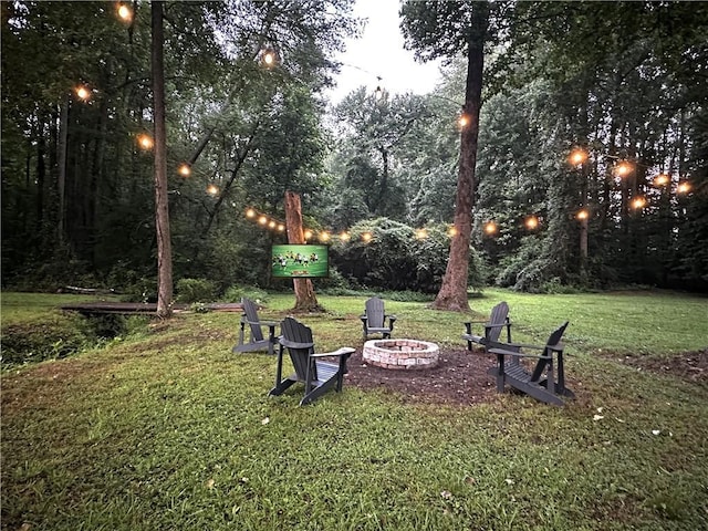 1642 Reflections Trl, Powder Springs, GA 30127 - view of grassy yard featuring a fire pit