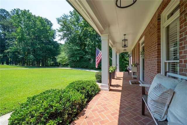 1642 Reflections Trl, Powder Springs, GA 30127 - covered porch with a yard and view of scattered trees