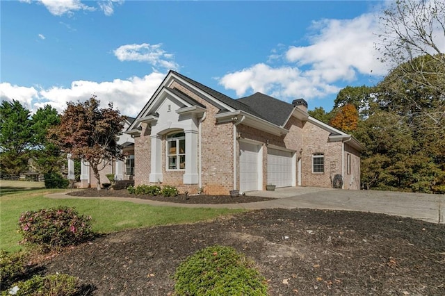 view of front facade with a garage and a front lawn