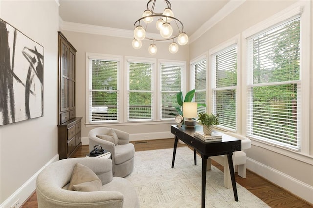 office area featuring an inviting chandelier, baseboards, ornamental molding, and light wood finished floors