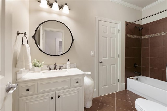 bathroom featuring crown molding, washtub / shower combination, tile patterned flooring, vanity, and toilet