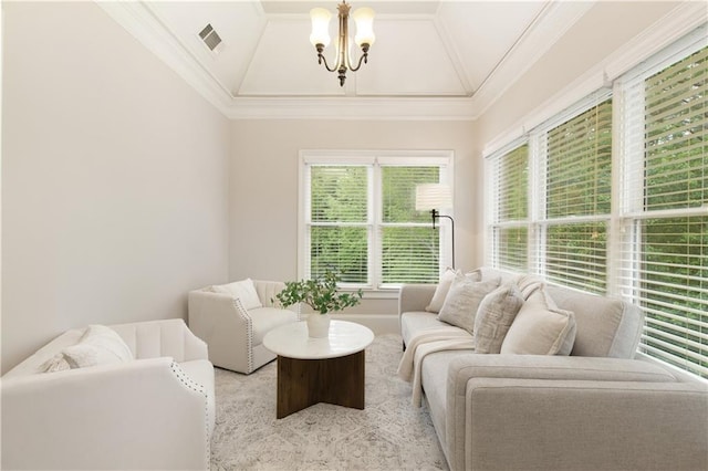 living room featuring crown molding, visible vents, lofted ceiling, and a chandelier