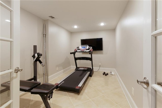 workout area featuring baseboards, recessed lighting, light tile patterned flooring, and visible vents