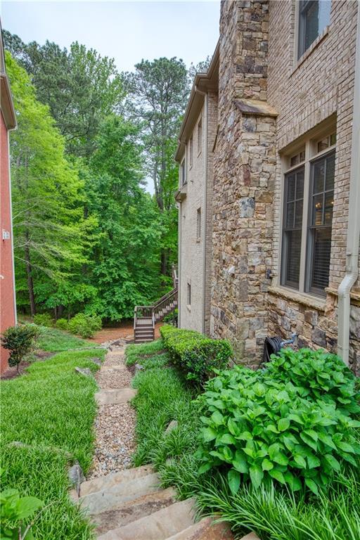 view of property exterior with stone siding