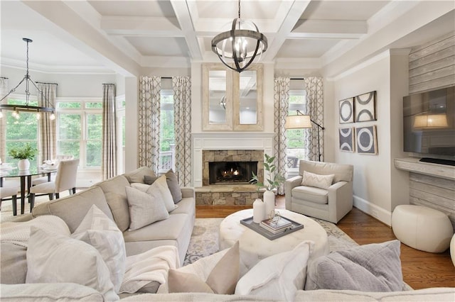 living room with baseboards, a chandelier, wood finished floors, and beam ceiling