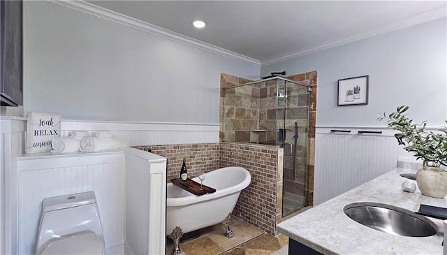 full bathroom with a stall shower, ornamental molding, wainscoting, and a freestanding bath