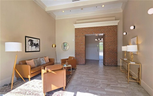 living room featuring crown molding, an inviting chandelier, stone finish floor, baseboards, and beam ceiling