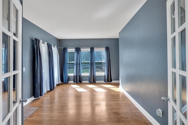 212 Thorncliff Way, Acworth, GA 30101 - empty room featuring french doors and wood finished floors