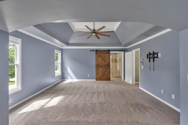 212 Thorncliff Way, Acworth, GA 30101 - carpeted spare room featuring a raised ceiling, ceiling fan, a barn door, arched walkways, and ornamental molding