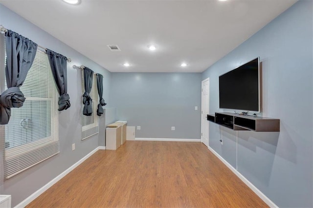 212 Thorncliff Way, Acworth, GA 30101 - unfurnished living room featuring light wood-style floors and recessed lighting