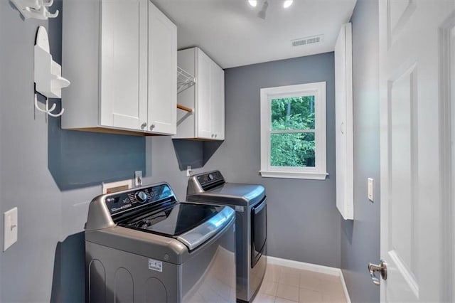 212 Thorncliff Way, Acworth, GA 30101 - washroom with independent washer and dryer, cabinet space, and light tile patterned floors