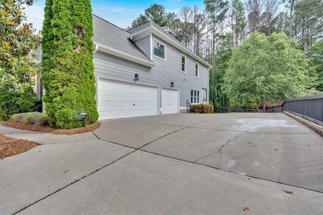 212 Thorncliff Way, Acworth, GA 30101 - view of property exterior featuring driveway and a garage
