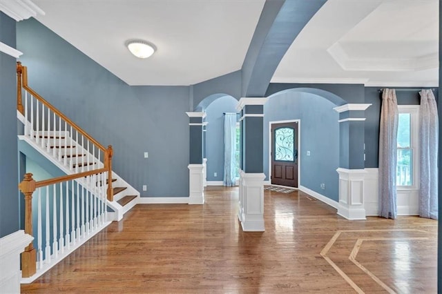 212 Thorncliff Way, Acworth, GA 30101 - entryway with plenty of natural light, arched walkways, wood finished floors, and decorative columns
